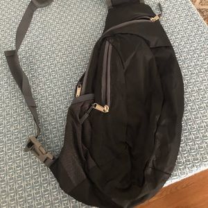 Nylon, athletic sling bag. Black.